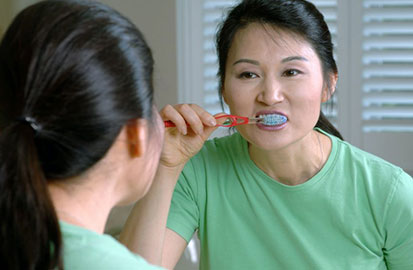 Teen Brushing Teeth Demonstrating Healthy Oral Care Habit