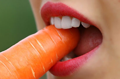 Person Biting Carrot