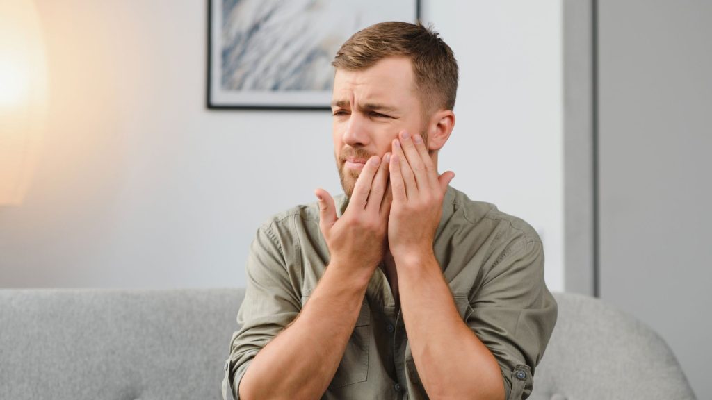 Person Experiencing Severe Tooth Pain