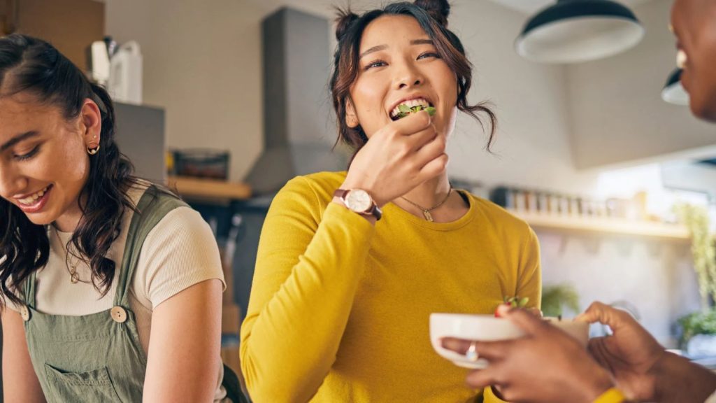 Woman Eating Healthy Food For Better Dental Health